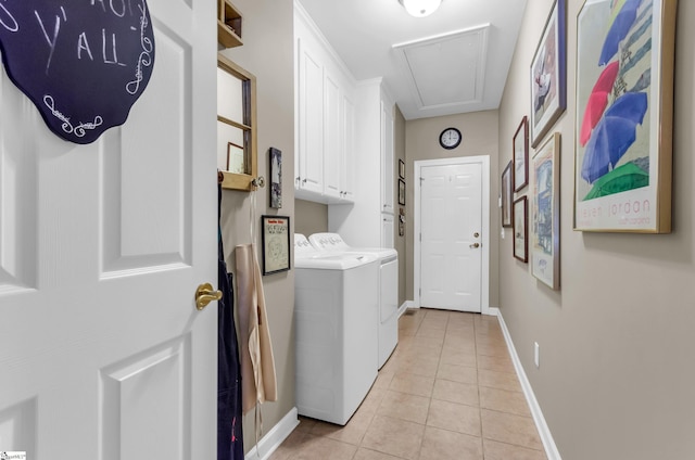 128 Banbury Cir, Simpsonville, SC 29650 - laundry room with washing machine and dryer, cabinet space, attic access, and light tile patterned flooring
