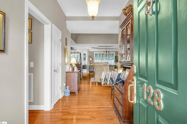 128 Banbury Cir, Simpsonville, SC 29650 - foyer featuring light wood-type flooring, ornamental molding, and a chandelier