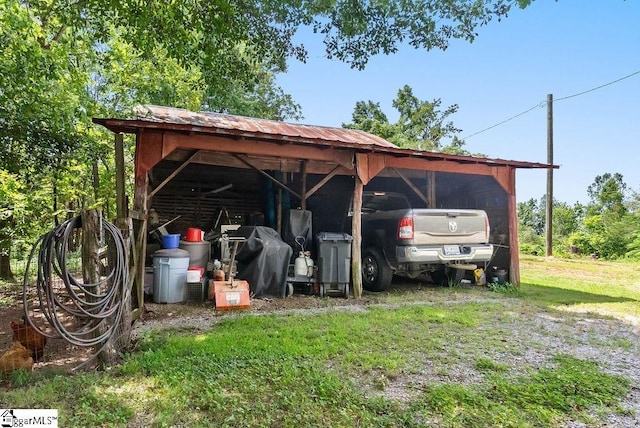 2115 Price House Rd, Woodruff, SC 29388 - view of parking featuring an outbuilding and a detached carport