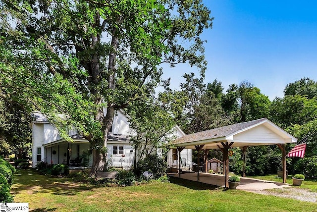 2115 Price House Rd, Woodruff, SC 29388 - rear view of property featuring a lawn and a detached carport