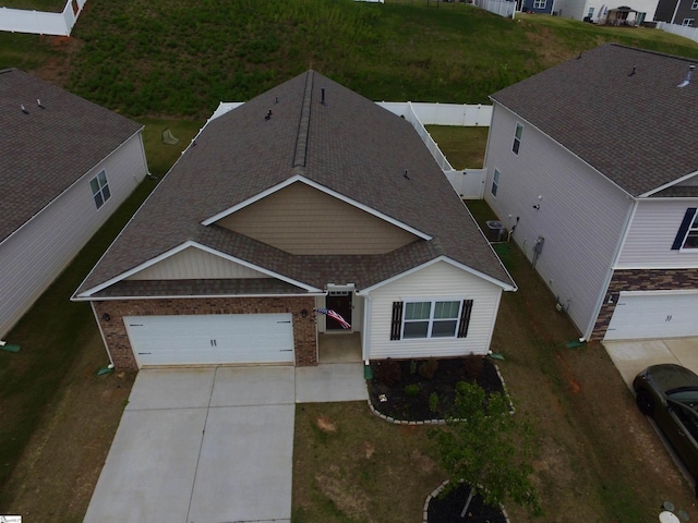 63 Oak Edge Ln, Greer, SC 29651 - view of front of house featuring concrete driveway, a garage, roof with shingles, and brick siding