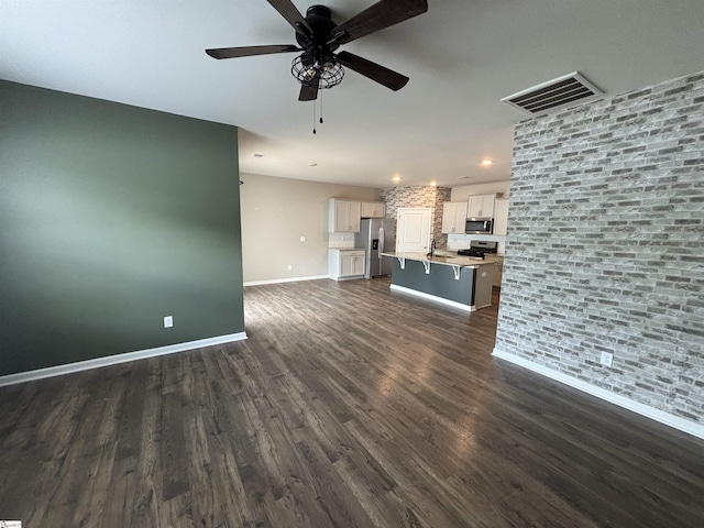 63 Oak Edge Ln, Greer, SC 29651 - unfurnished living room featuring dark wood finished floors, ceiling fan, and recessed lighting