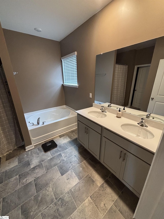 63 Oak Edge Ln, Greer, SC 29651 - full bath featuring double vanity, a bath, and stone tile floors