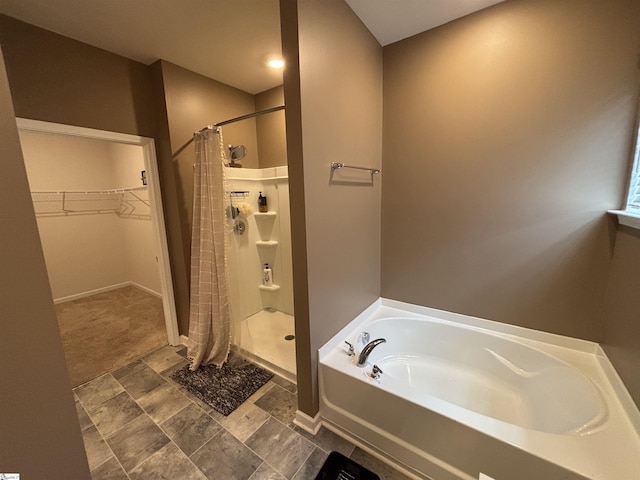 63 Oak Edge Ln, Greer, SC 29651 - full bathroom featuring a shower stall, a garden tub, and a walk in closet