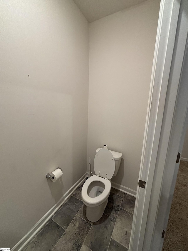63 Oak Edge Ln, Greer, SC 29651 - bathroom featuring toilet and baseboards
