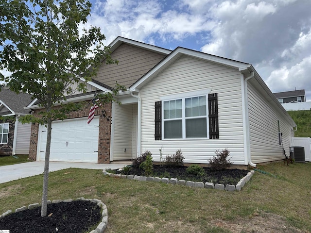 63 Oak Edge Ln, Greer, SC 29651 - view of front of house with concrete driveway, an attached garage, and a front lawn