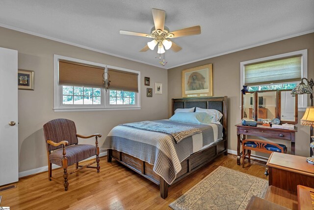 135 James Ave, Wellford, SC 29385 - bedroom featuring wood finished floors, crown molding, and a ceiling fan