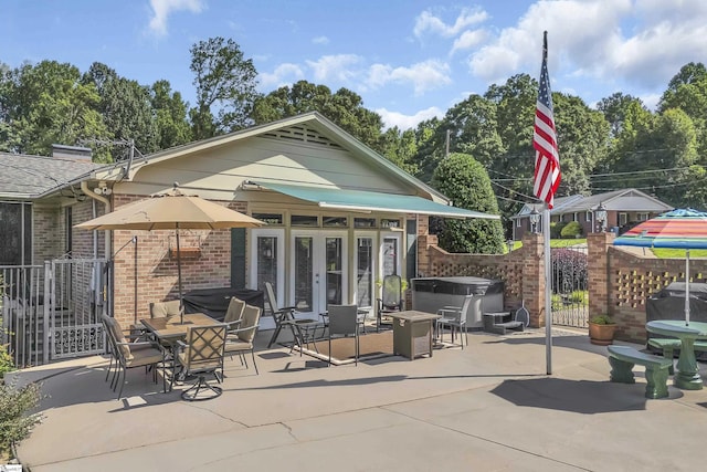 135 James Ave, Wellford, SC 29385 - view of patio with a hot tub, french doors, and outdoor dining space