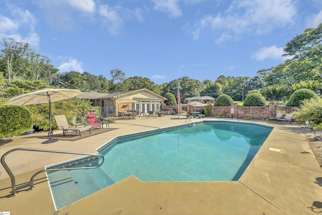 135 James Ave, Wellford, SC 29385 - view of swimming pool with a patio and view of wooded area