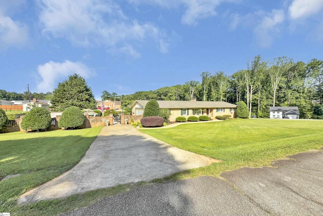 135 James Ave, Wellford, SC 29385 - ranch-style home with concrete driveway and a front lawn