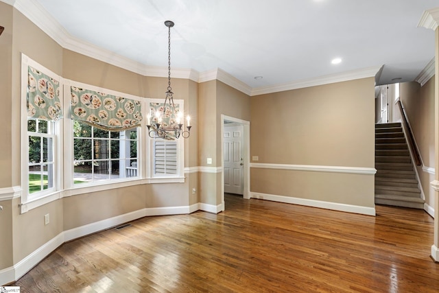 15 Annas Pl, Simpsonville, SC 29681 - unfurnished dining area featuring wood finished floors, a chandelier, stairway, crown molding, and recessed lighting