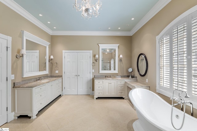 15 Annas Pl, Simpsonville, SC 29681 - bathroom with two vanities, a freestanding tub, plenty of natural light, tile patterned flooring, and crown molding