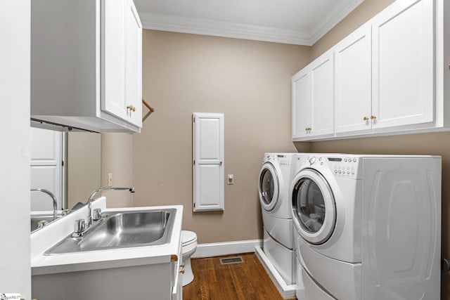 15 Annas Pl, Simpsonville, SC 29681 - washroom with washing machine and dryer, ornamental molding, and dark wood-style floors