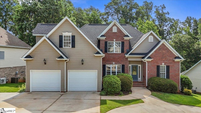 118 Glencreek Dr, Greer, SC 29650 - traditional-style house featuring a garage, driveway, brick siding, and roof with shingles