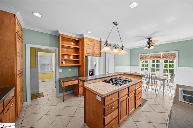 118 Glencreek Dr, Greer, SC 29650 - kitchen with stainless steel refrigerator with ice dispenser, black gas stovetop, ceiling fan, a wainscoted wall, and ornamental molding