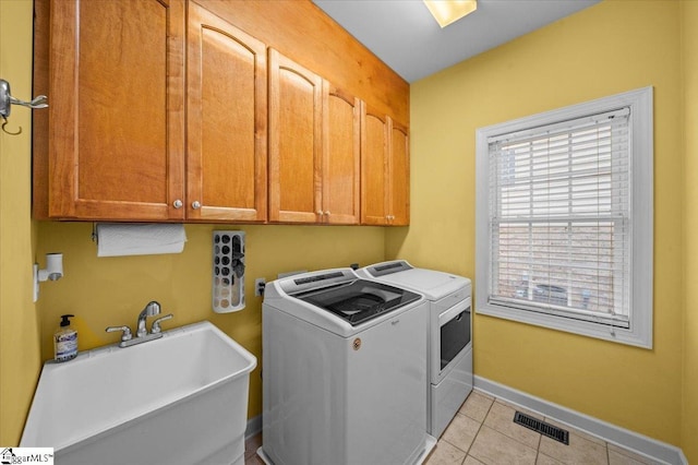 118 Glencreek Dr, Greer, SC 29650 - laundry area with cabinet space, separate washer and dryer, and light tile patterned floors