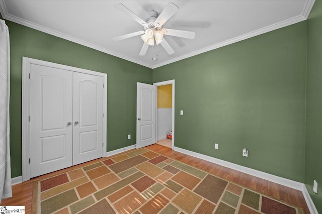 118 Glencreek Dr, Greer, SC 29650 - unfurnished bedroom with wood finished floors, ornamental molding, a closet, and a ceiling fan