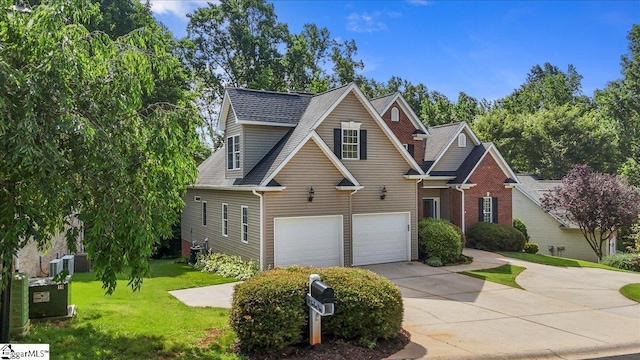 118 Glencreek Dr, Greer, SC 29650 - traditional home featuring a garage, driveway, a front lawn, and a shingled roof