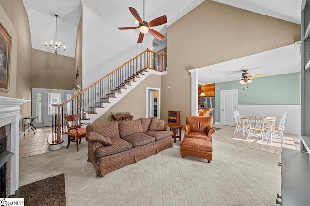 118 Glencreek Dr, Greer, SC 29650 - carpeted living area featuring a ceiling fan, high vaulted ceiling, a fireplace, stairs, and tile patterned floors