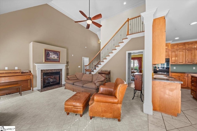 118 Glencreek Dr, Greer, SC 29650 - living room featuring ceiling fan, crown molding, stairway, a towering ceiling, and recessed lighting
