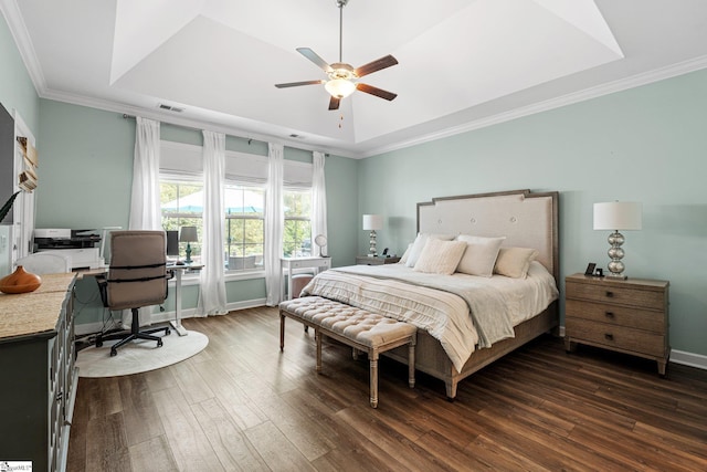 217 Holstein Ct, Fountain Inn, SC 29644 - bedroom featuring a raised ceiling, dark wood-style floors, a desk, ornamental molding, and a ceiling fan