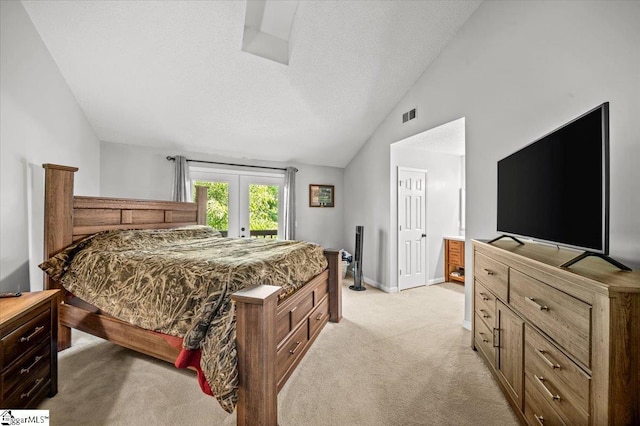 2 Creekside Way, Greenville, SC 29609 - bedroom with access to outside, light carpet, vaulted ceiling, french doors, and a textured ceiling