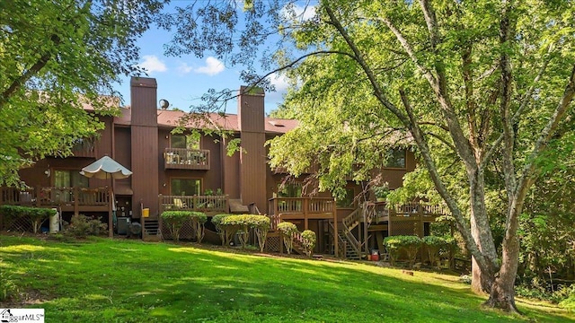 2 Creekside Way, Greenville, SC 29609 - back of house featuring a lawn, a balcony, a chimney, a wooden deck, and stairway