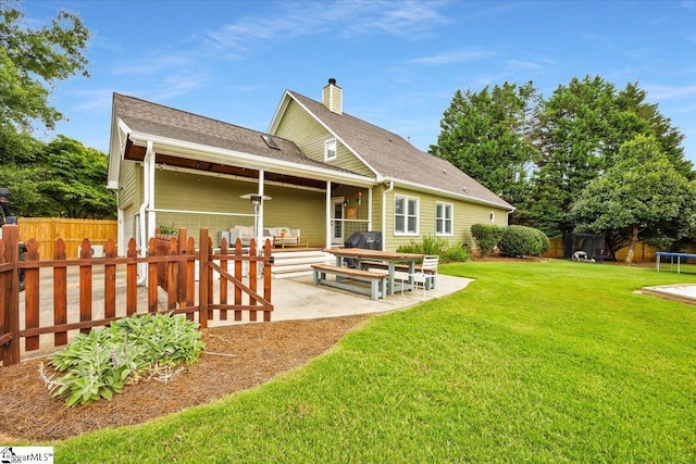 109 W Fieldsparrow Cir, Greenville, SC 29615 - rear view of property with a trampoline, a chimney, a patio area, and a shingled roof