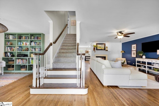 109 W Fieldsparrow Cir, Greenville, SC 29615 - stairs with wood finished floors, a ceiling fan, and a fireplace