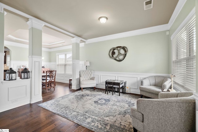 415 Bridge Crossing Dr, Simpsonville, SC 29681 - living room featuring ornate columns, ornamental molding, dark wood finished floors, a decorative wall, and wainscoting
