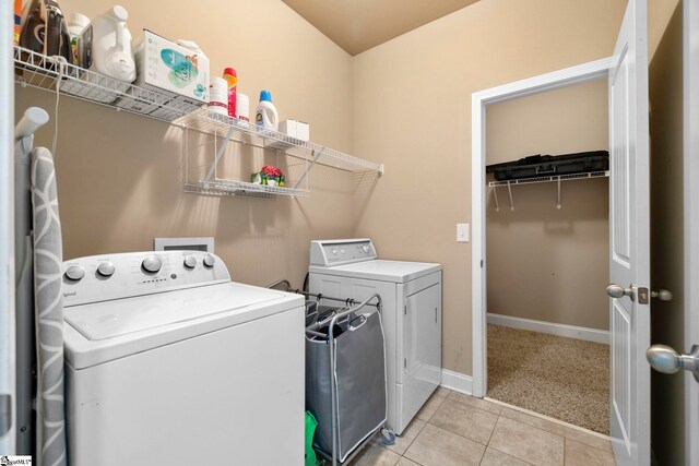 415 Bridge Crossing Dr, Simpsonville, SC 29681 - laundry room with washing machine and clothes dryer, light tile patterned floors, and light carpet