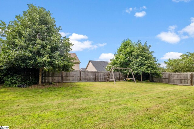 415 Bridge Crossing Dr, Simpsonville, SC 29681 - fenced backyard with a playground