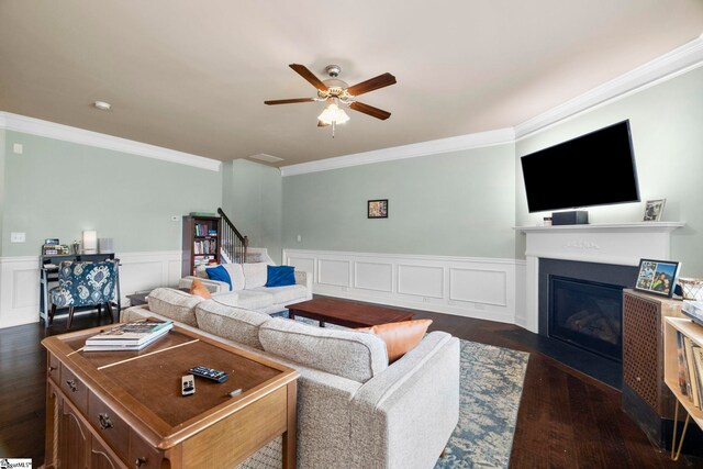 415 Bridge Crossing Dr, Simpsonville, SC 29681 - living area with ornamental molding, dark wood finished floors, ceiling fan, a fireplace with flush hearth, and wainscoting