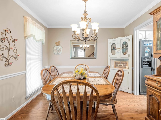 209 Thornhill Dr, Spartanburg, SC 29301 - dining area featuring crown molding, a chandelier, and light wood-type flooring