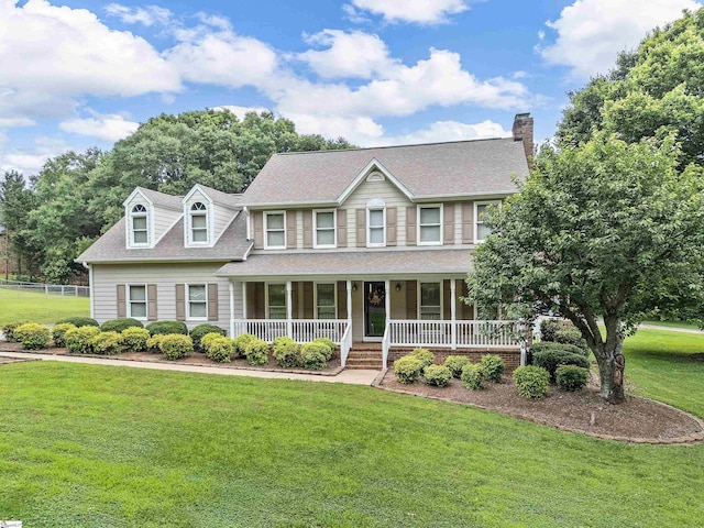 209 Thornhill Dr, Spartanburg, SC 29301 - colonial inspired home featuring a porch, a front yard, a chimney, and a shingled roof