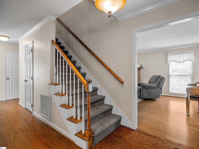 209 Thornhill Dr, Spartanburg, SC 29301 - staircase with a textured ceiling, wood finished floors, and ornamental molding