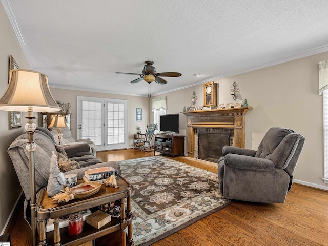 209 Thornhill Dr, Spartanburg, SC 29301 - living area featuring ornamental molding, a brick fireplace, a ceiling fan, and wood finished floors