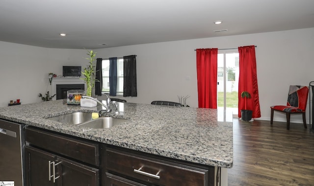 1421 Trotting Ave, Roebuck, SC 29376 - kitchen featuring dishwasher, an island with sink, light stone counters, recessed lighting, and dark wood-style floors