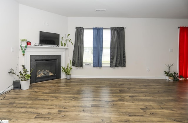 1421 Trotting Ave, Roebuck, SC 29376 - unfurnished living room with wood finished floors and a glass covered fireplace