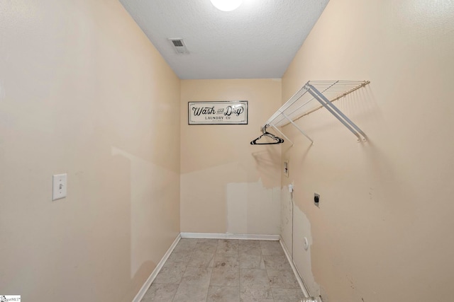125 Woodgrove Way, Greer, SC 29651 - laundry area featuring hookup for an electric dryer and a textured ceiling
