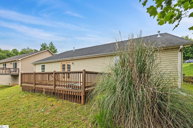 125 Woodgrove Way, Greer, SC 29651 - rear view of house featuring a deck, a lawn, and roof with shingles