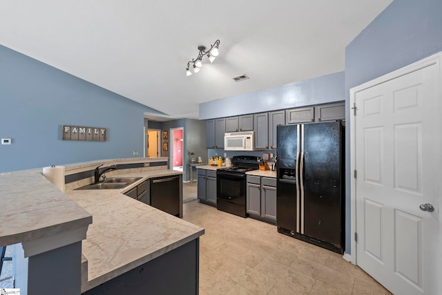125 Woodgrove Way, Greer, SC 29651 - kitchen featuring black appliances, light countertops, lofted ceiling, and gray cabinets