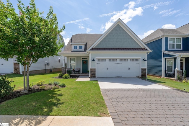 27 Mossycup Rd, Taylors, SC 29687 - craftsman-style home featuring concrete driveway, a garage, stone siding, a front lawn, and a standing seam roof