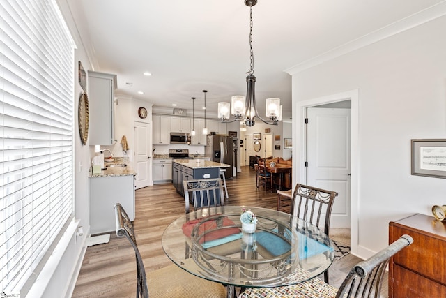 27 Mossycup Rd, Taylors, SC 29687 - dining room with a chandelier, light wood finished floors, ornamental molding, and recessed lighting