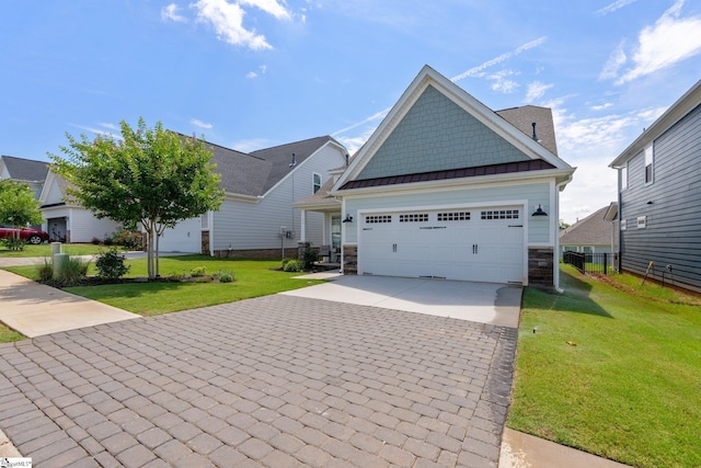 27 Mossycup Rd, Taylors, SC 29687 - craftsman-style house with stone siding, driveway, a standing seam roof, a garage, and a metal roof