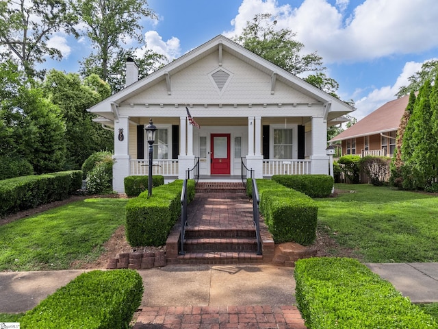 772 Glendalyn Ave, Spartanburg, SC 29302 - bungalow-style house with a chimney, a porch, and a front lawn