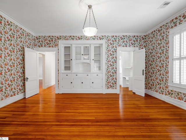 772 Glendalyn Ave, Spartanburg, SC 29302 - unfurnished dining area featuring wallpapered walls, light wood finished floors, and crown molding