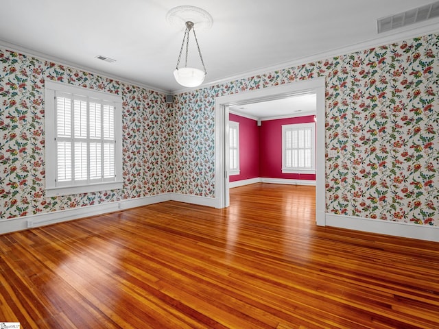 772 Glendalyn Ave, Spartanburg, SC 29302 - unfurnished room with hardwood / wood-style floors, ornamental molding, plenty of natural light, and wallpapered walls