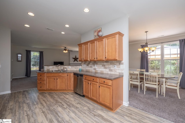 112 Pendock Ln, Piedmont, SC 29673 - kitchen with stainless steel dishwasher, a ceiling fan, a chandelier, a peninsula, and backsplash