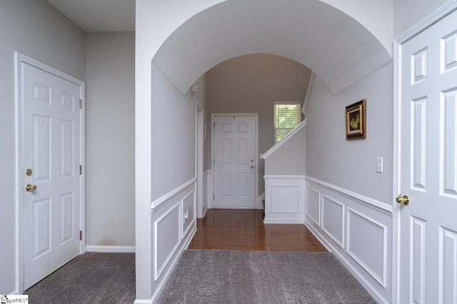 112 Pendock Ln, Piedmont, SC 29673 - hallway with arched walkways, carpet floors, wainscoting, and a decorative wall